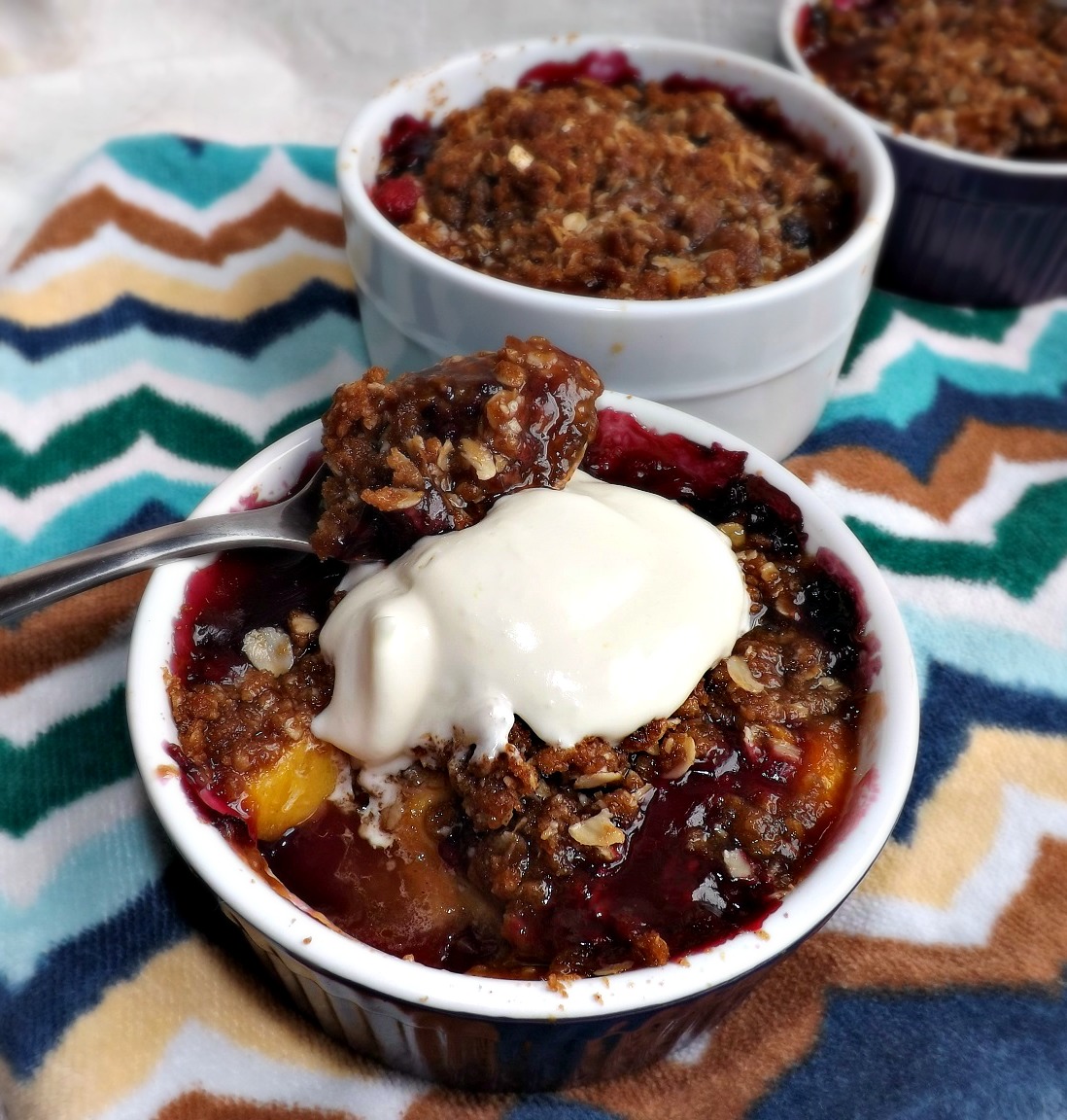 Triple Berry & Nectarine Crisp With Buttery Streusel & Lime Cream Topping